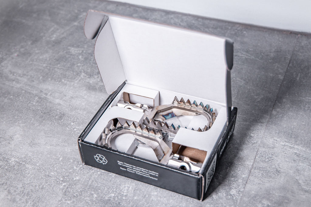 RME023-titanium-footpegs-photo-inside-box